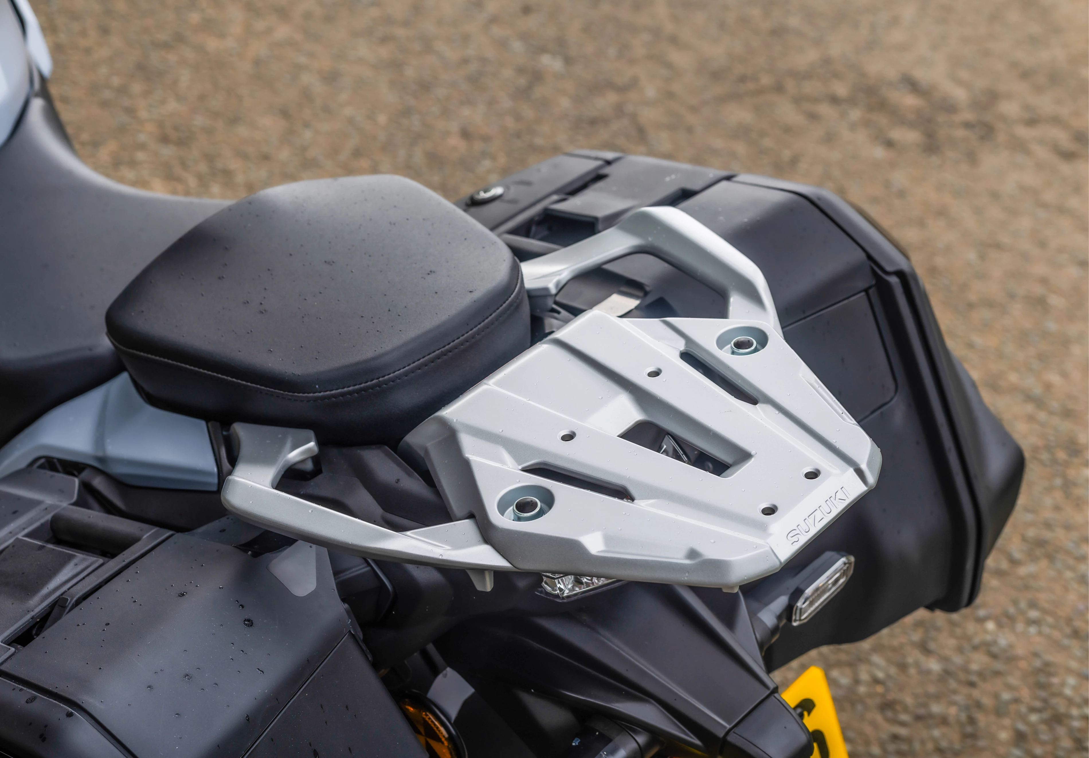 Suzuki GSX-S1000GX+ rear grab rails and carrier plate close-up