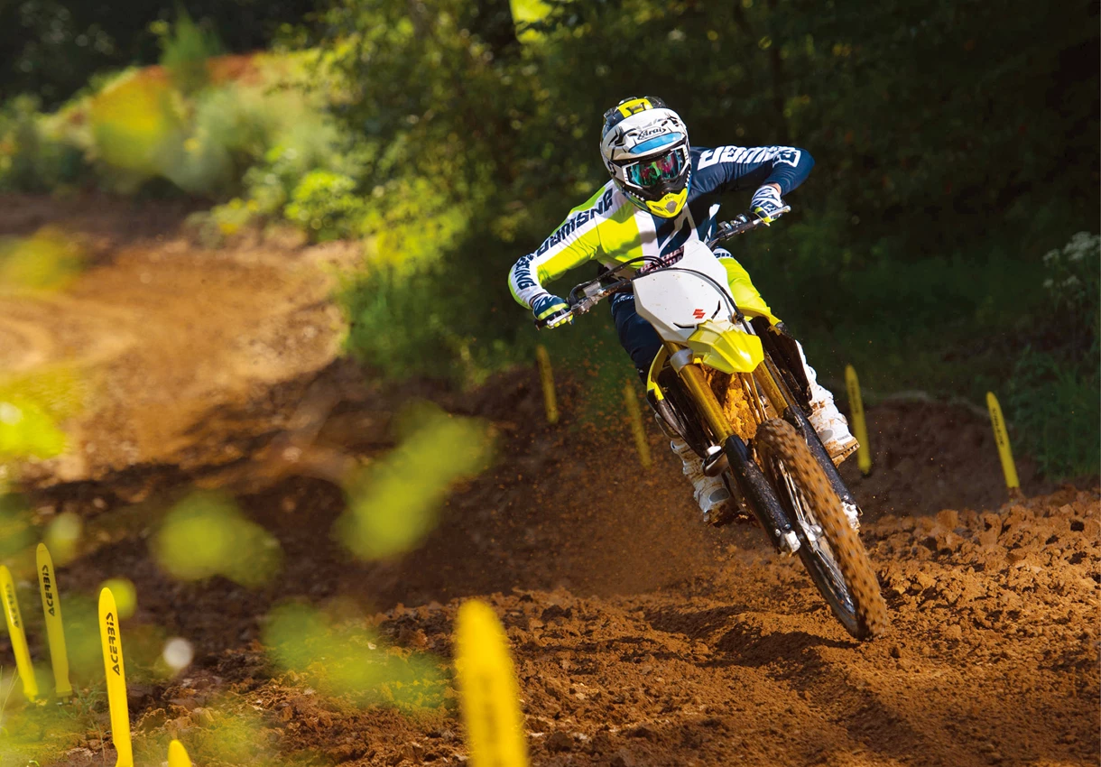 Suzuki RM-Z450 performing a jump on a Motorcross track