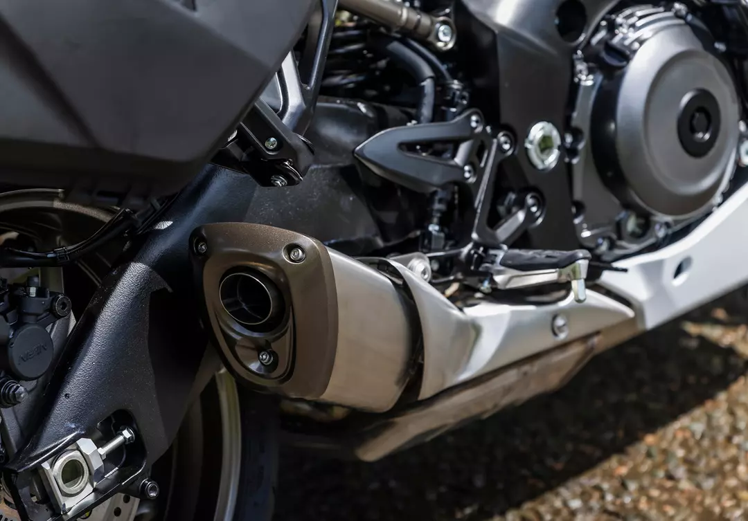 Suzuki GSX-S1000GT+ close up of the exhaust and engine from behind the exhaust