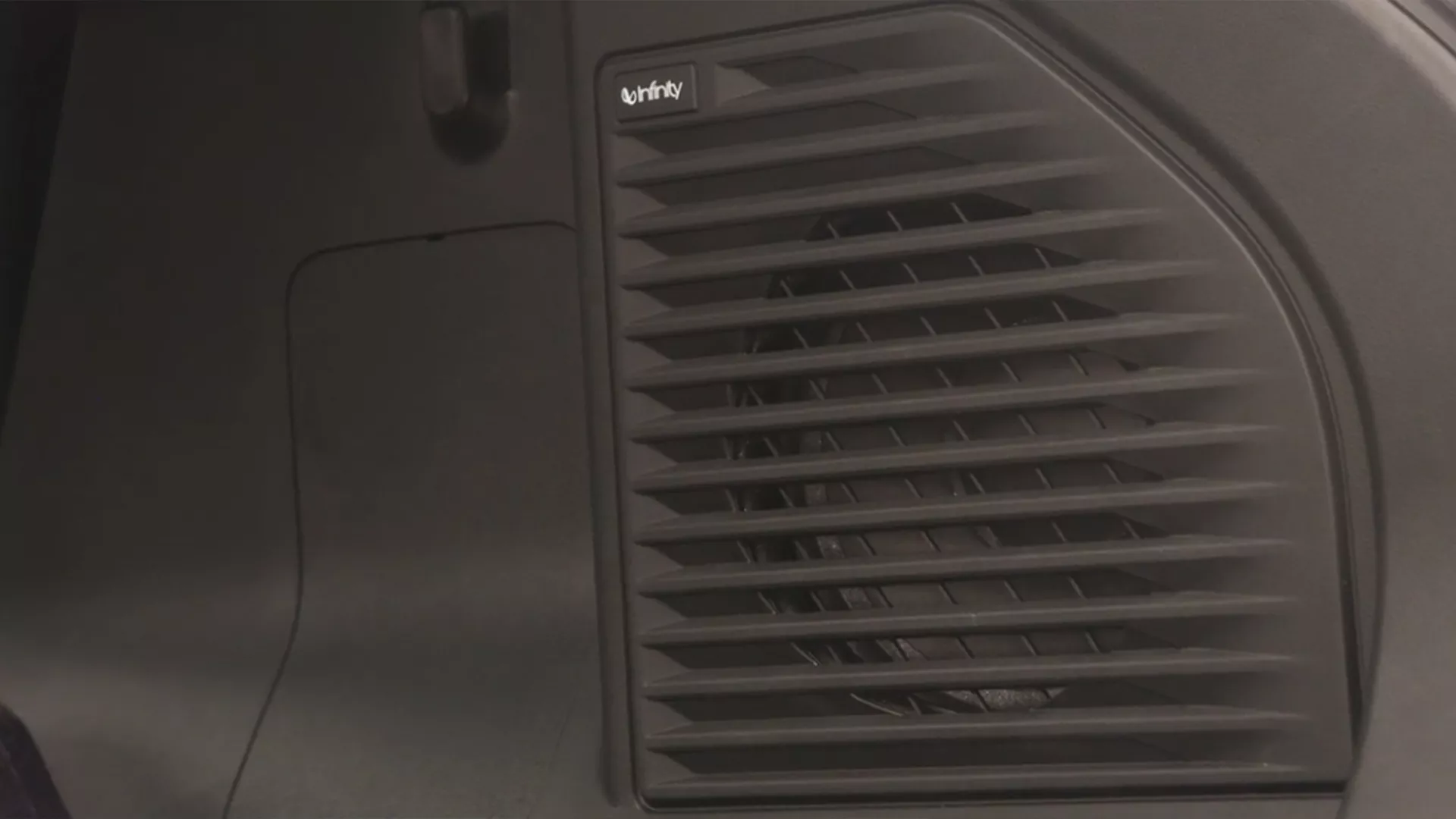 Close-up of the Suzuki e Vitara’s Infinity audio speaker integrated into the vehicle’s interior panel