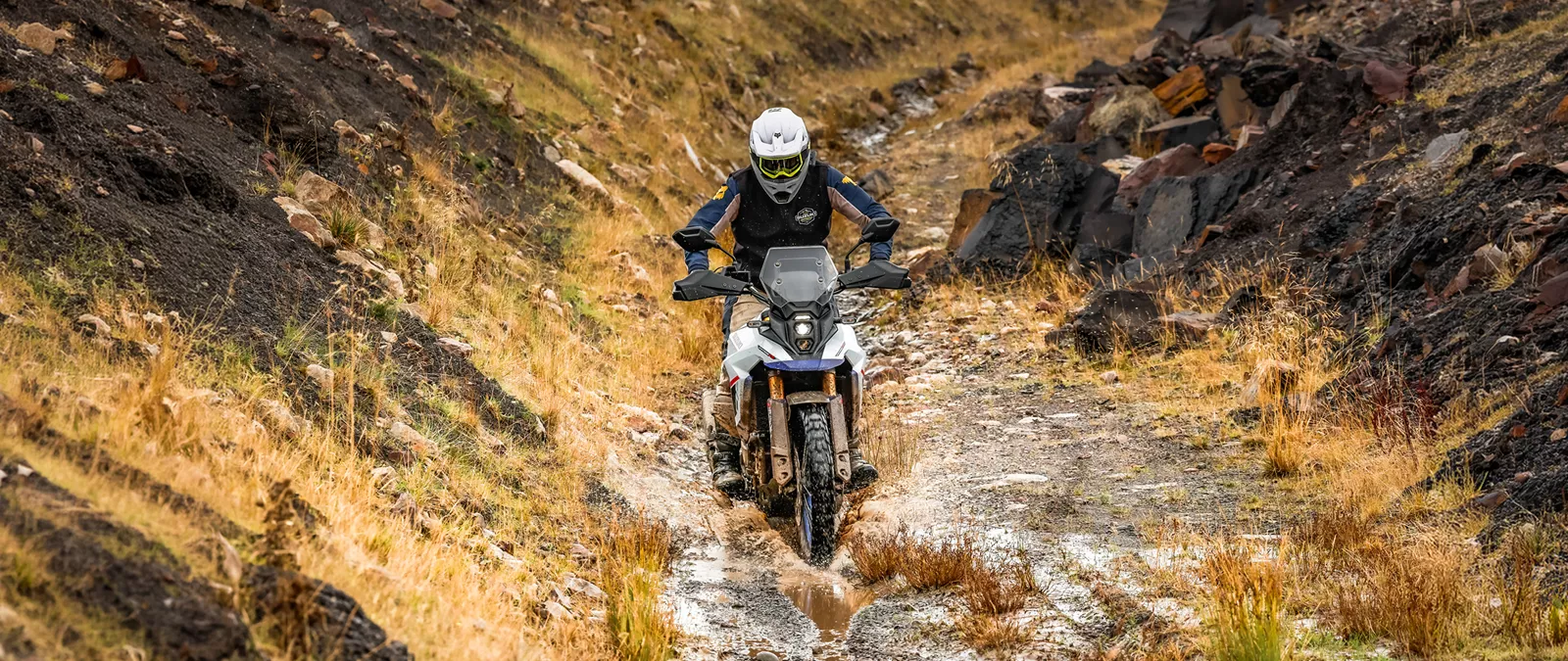 Suzuki V-Strom 800DE head on coming through a water splash
