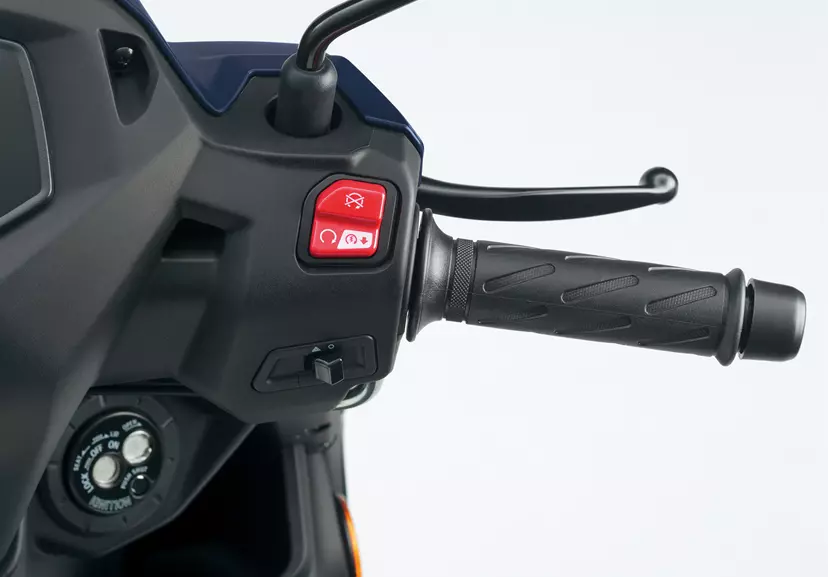 Suzuki Address 125 scooter close up of handlebar and control buttons.