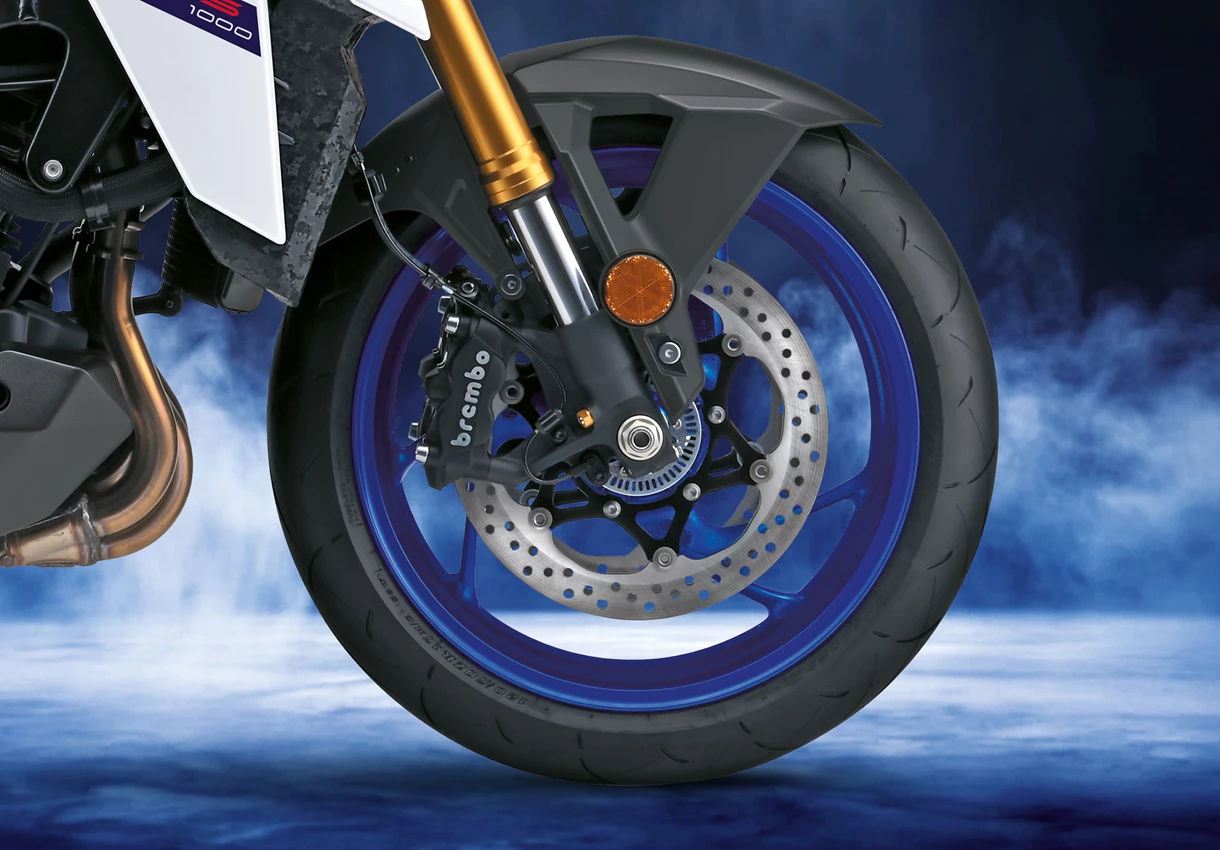 Suzuki GSX-S1000 Brembo brakes with a studio blue background