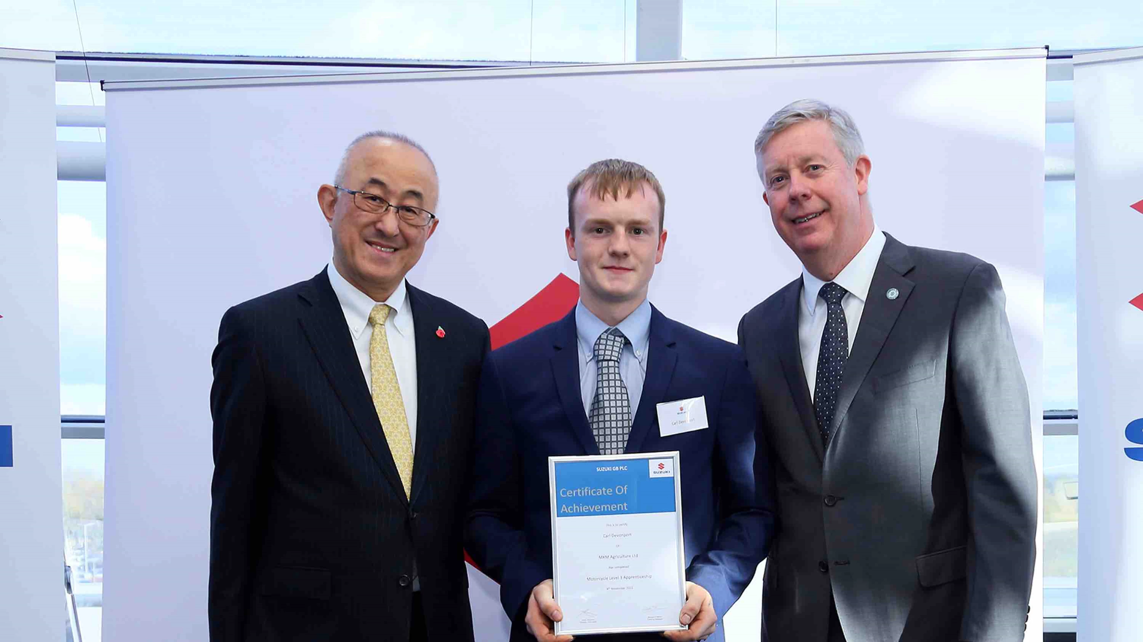 Apprentice receiving graduation certificate