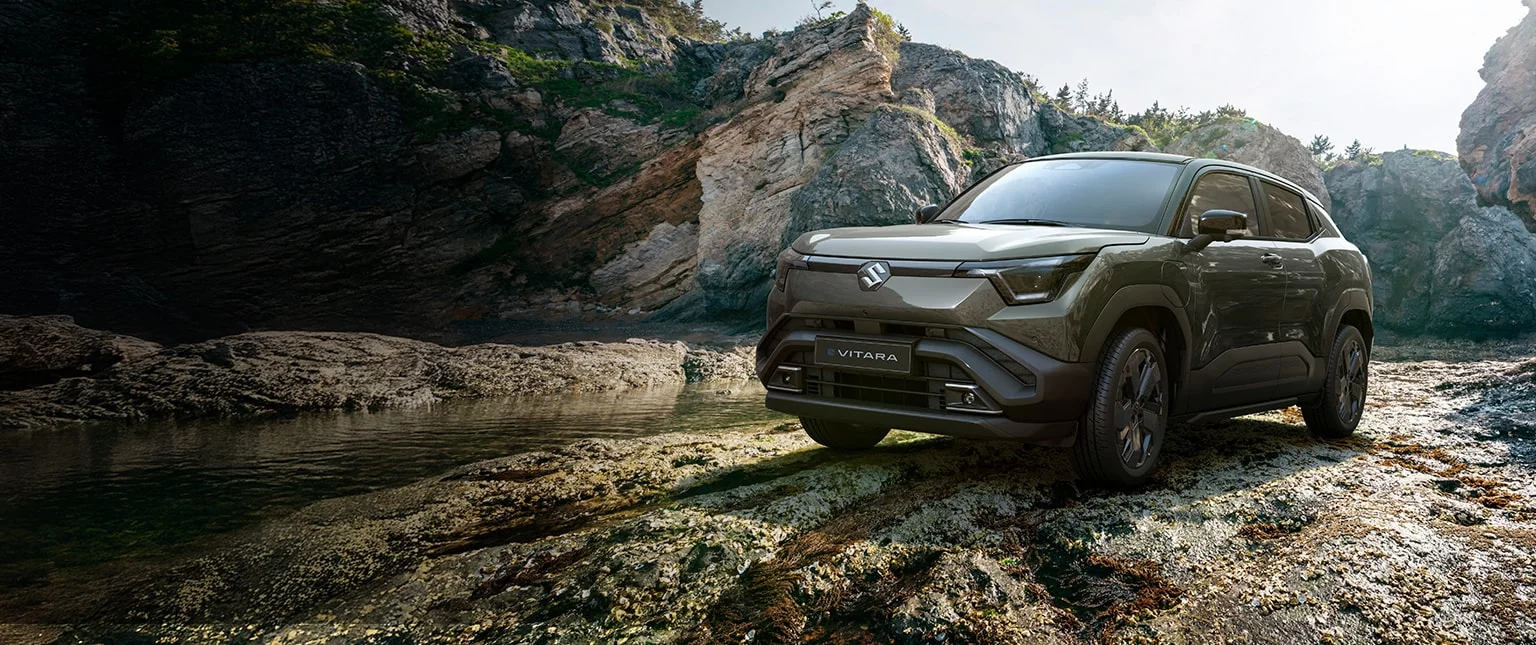 Suzuki e Vitara khaki rocky landscape