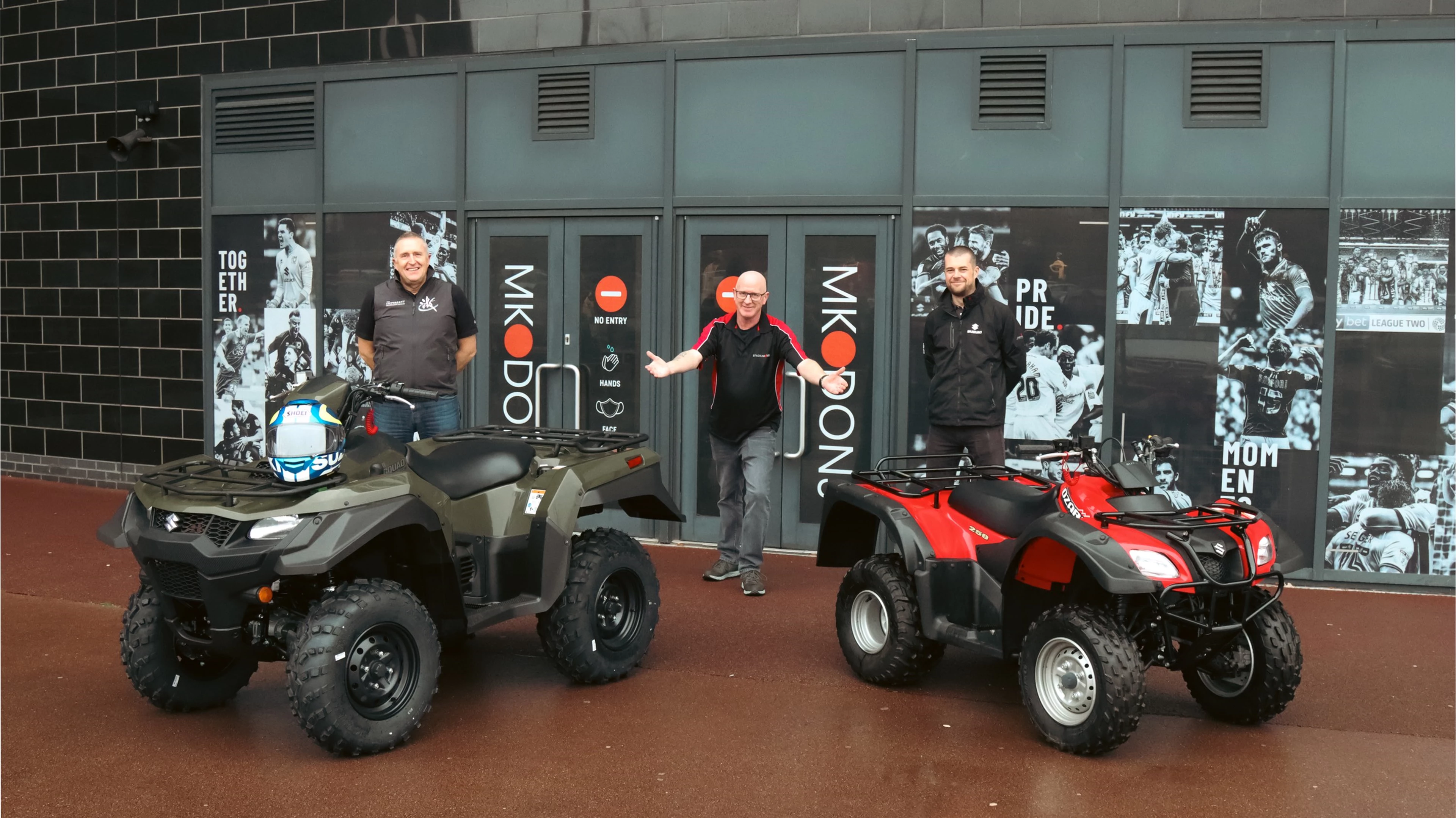 Two Suzuki ATVs outside of MK Dons