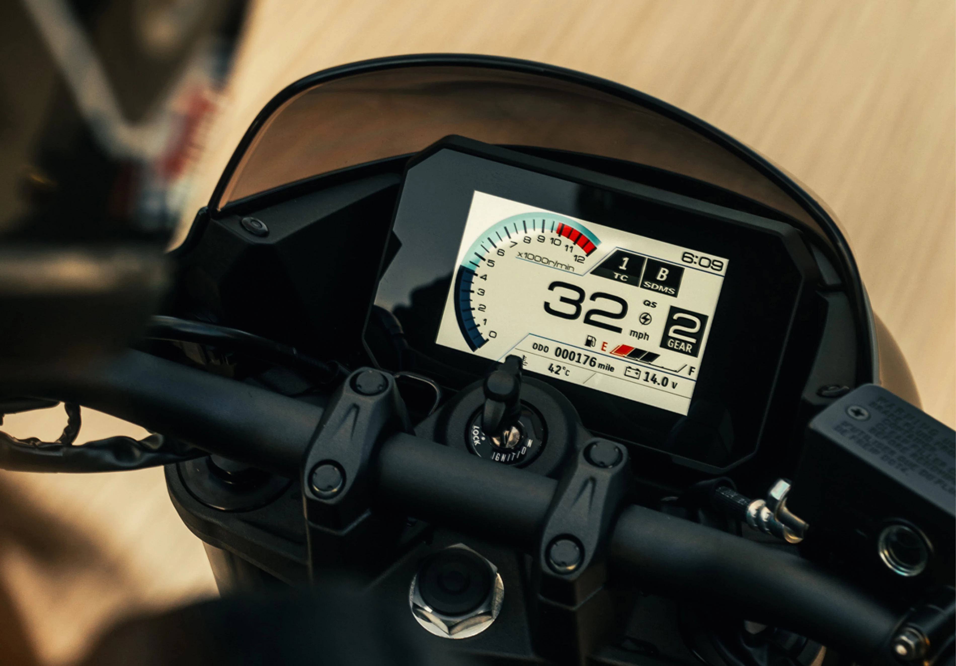 Suzuki GSX-8TT colour TFT dash close up over the riders shoulder.