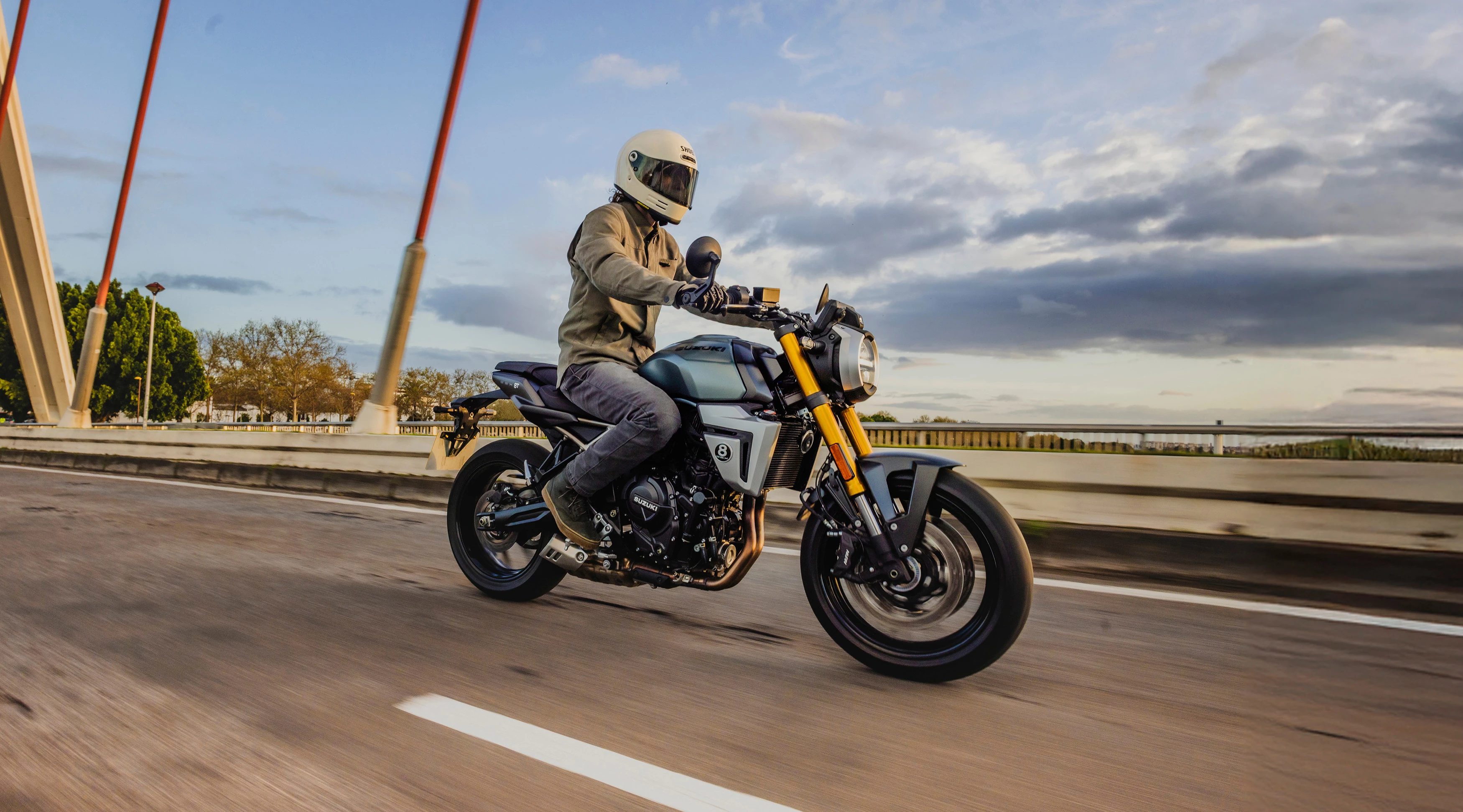 Suzuki GSX-8T riding across a bridge 