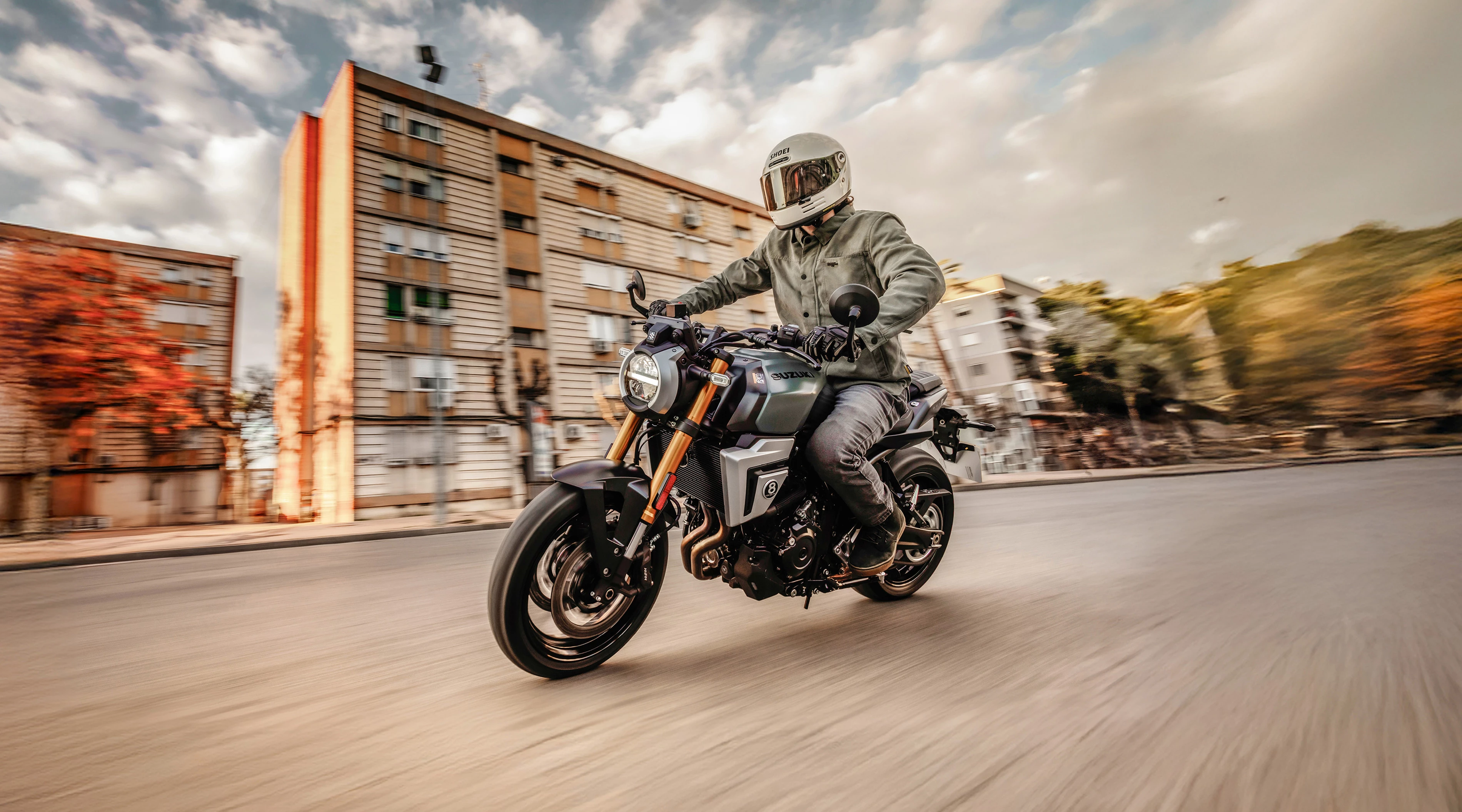 Suzuki GSX-8T riding through the outskirts of town.