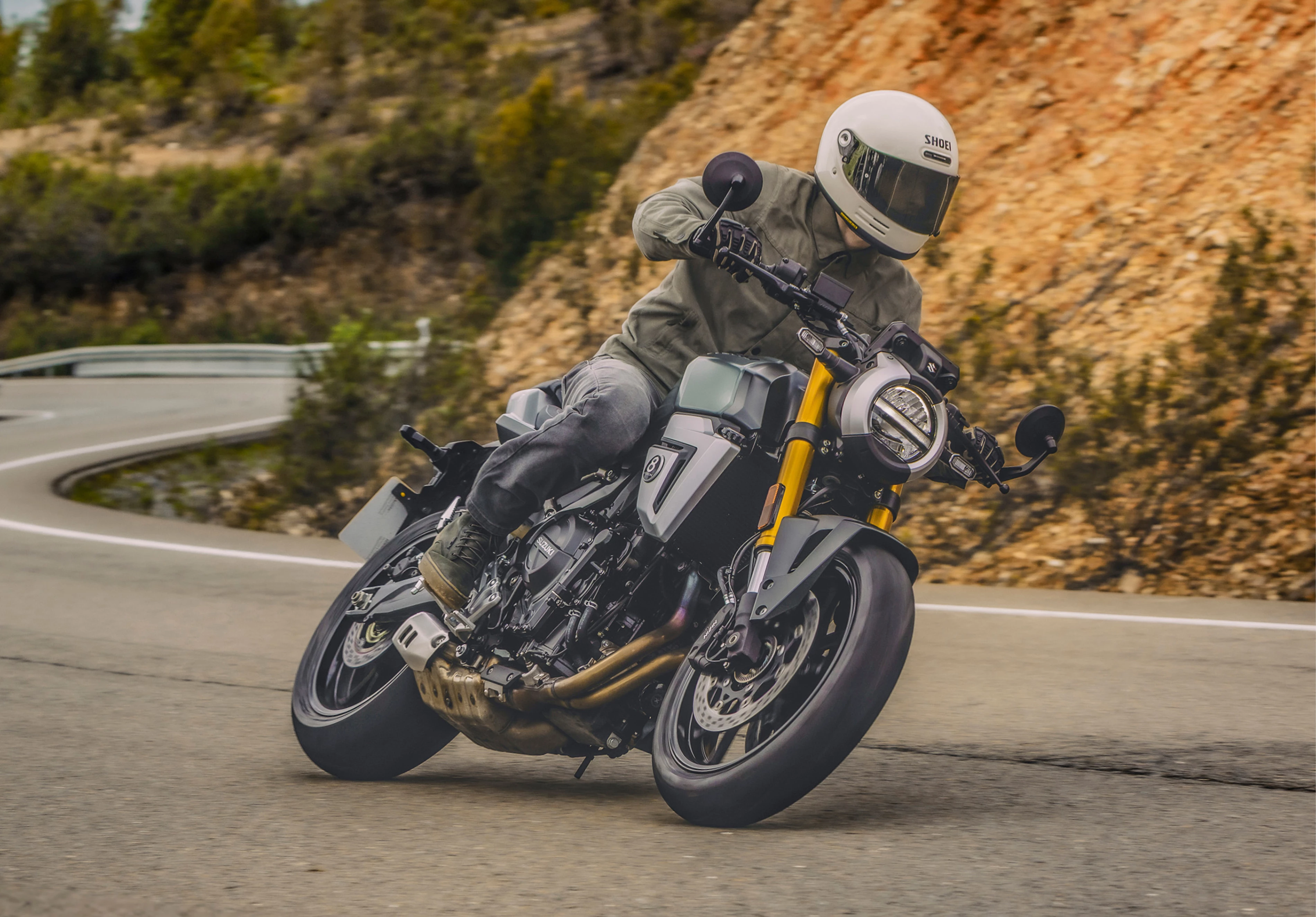 Suzuki GSX-8T leaning over hard on a mountain road