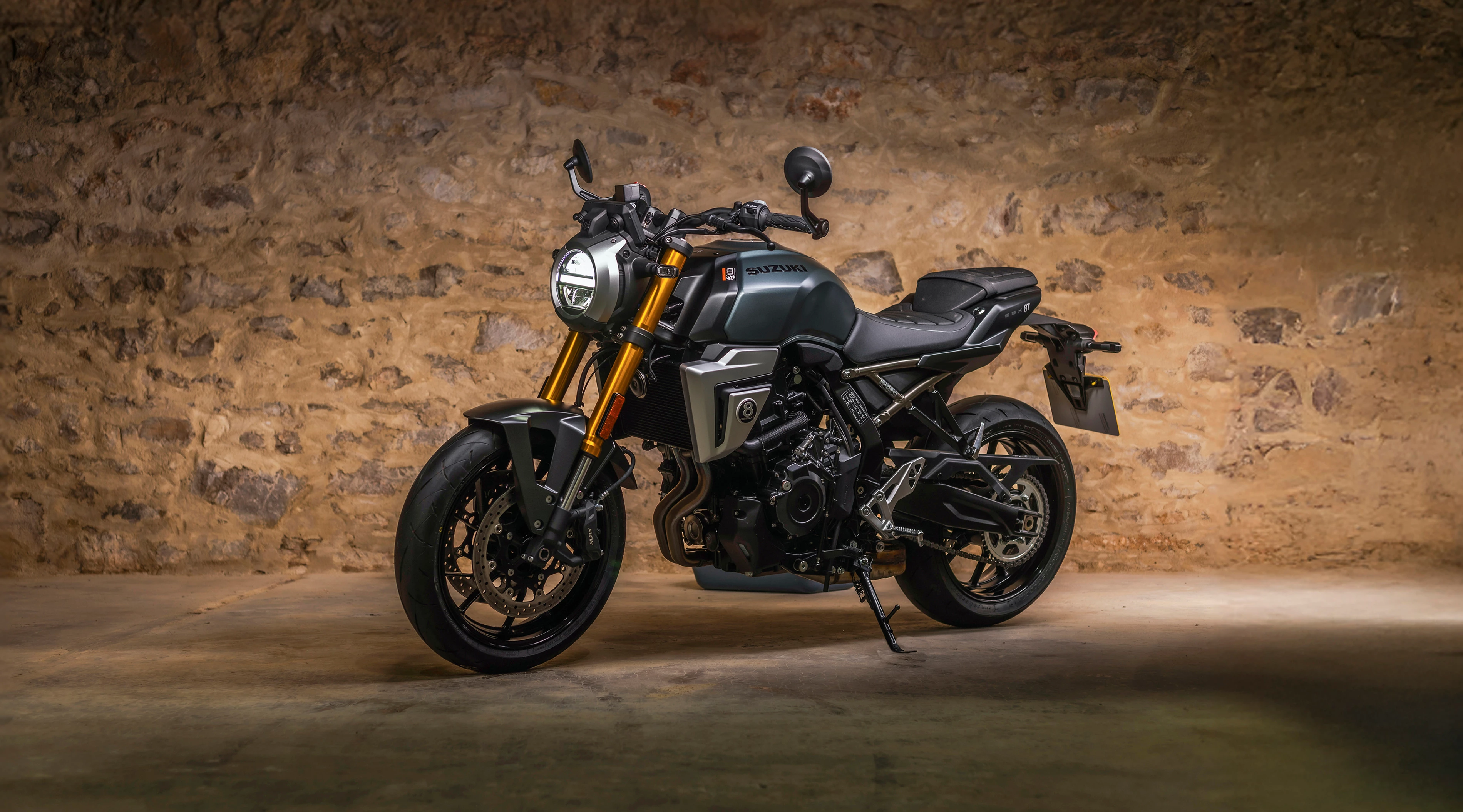 Suzuki GSX-8T left hand side static with a barn wall in the background
