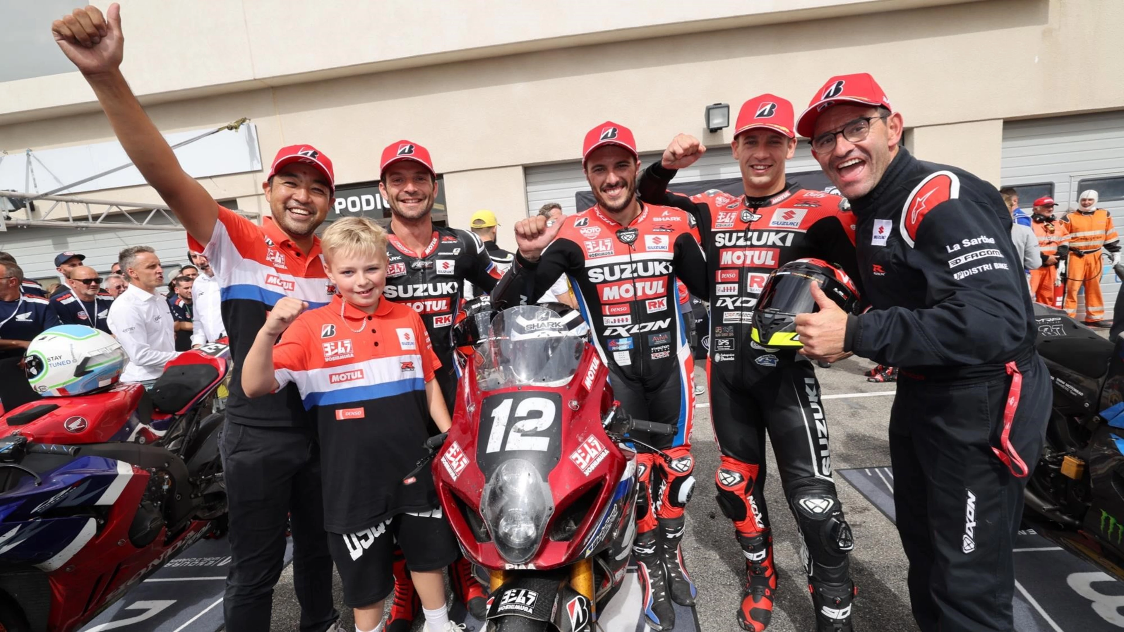 SERT team celebrate motorcycle race win