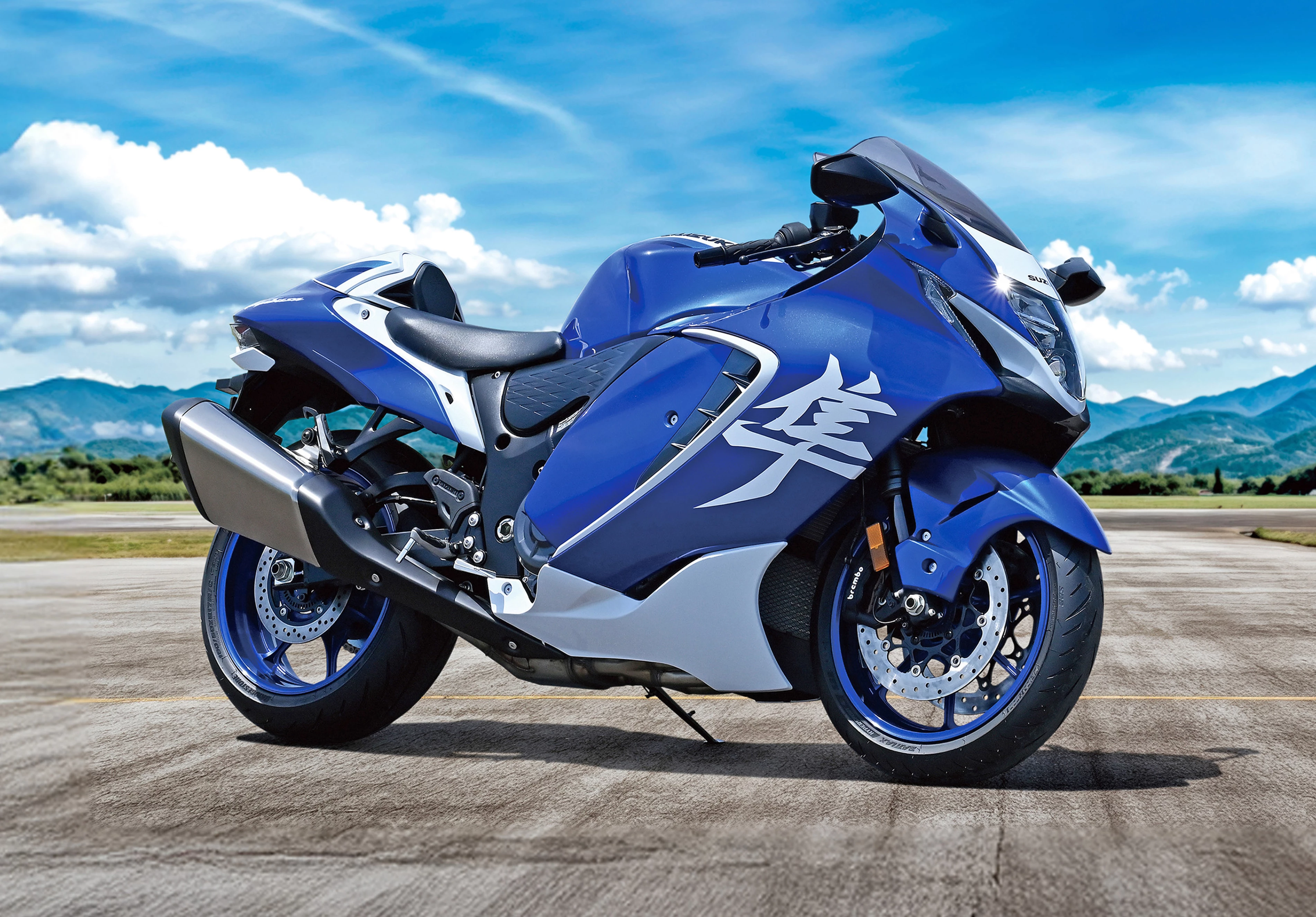 Suzuki Hayabusa Special Edition static image on a runway with mountains behind.