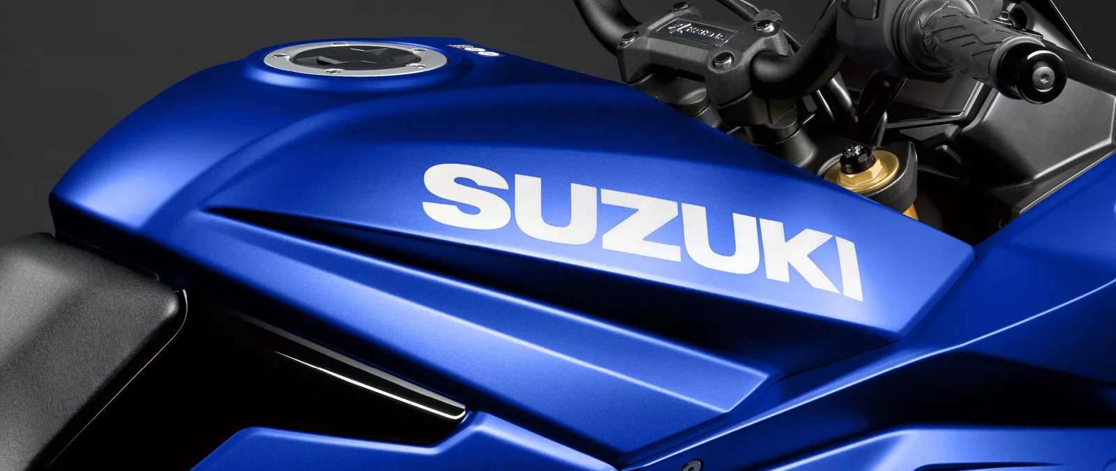 Suzuki Katana blue close up of the right hand side of the tank and the Suzuki logo