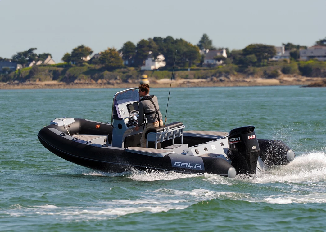 GALA V580 RIB with fishing rods on the water powered by a Suzuki outboard