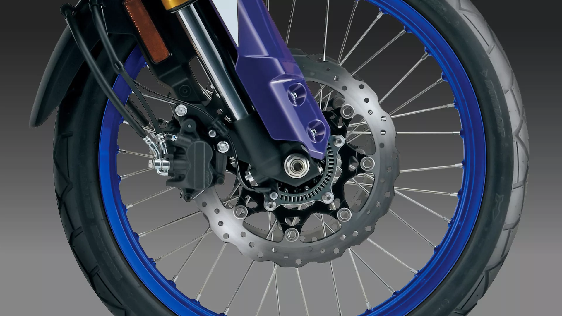 Suzuki V-Strom 800DE front brake and wheel close up