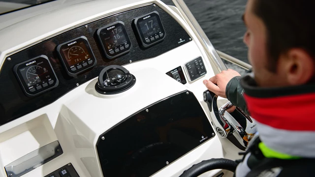Four Suzuki screens used on a boat.