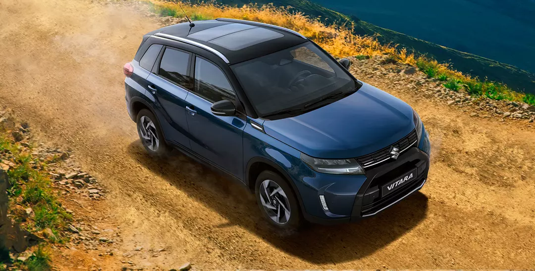 Sphere Blue Suzuki Vitara driving along the coast