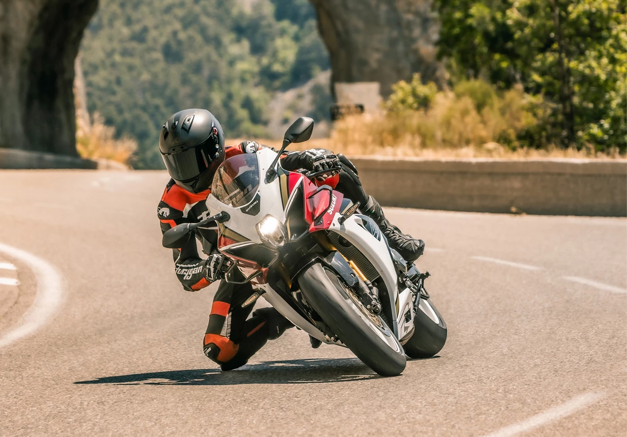 Suzuki GSX-R1000R leaning into a corner on a country road
