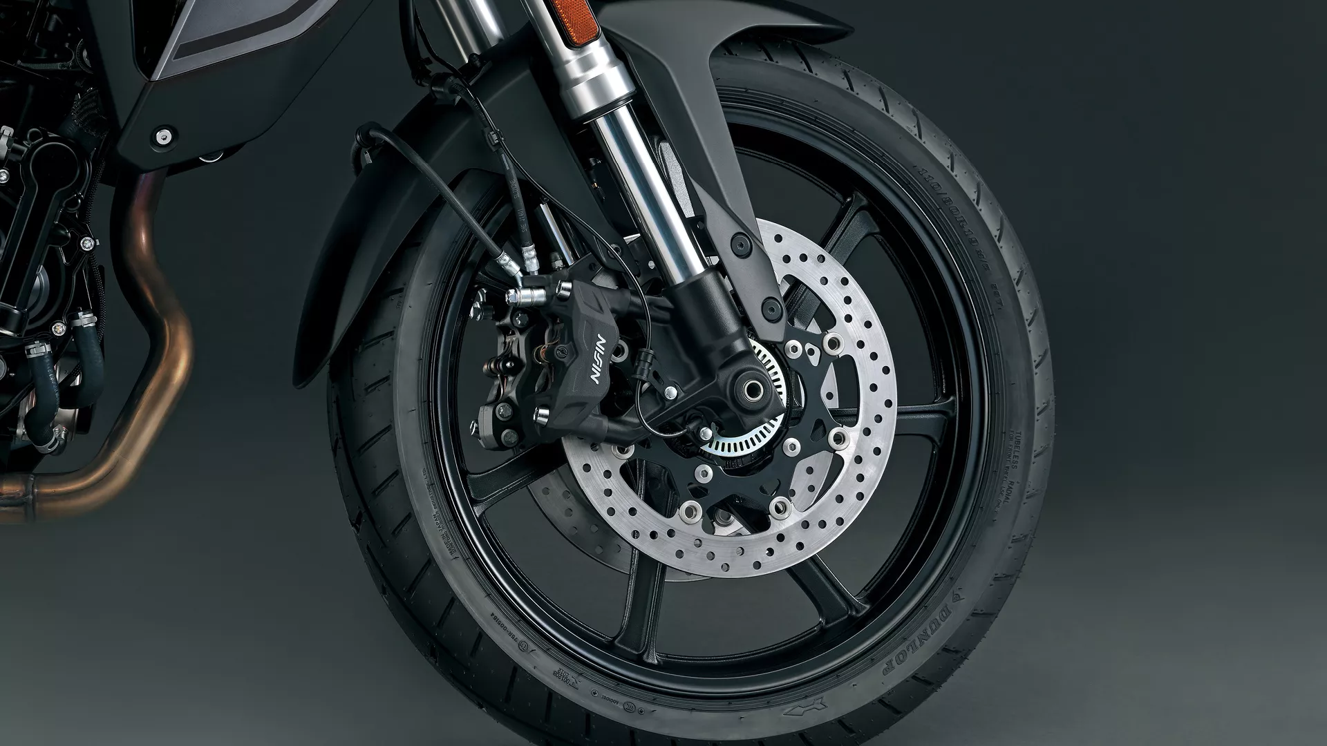 Suzuki V-Strom 800RE front tyre and brakes close up