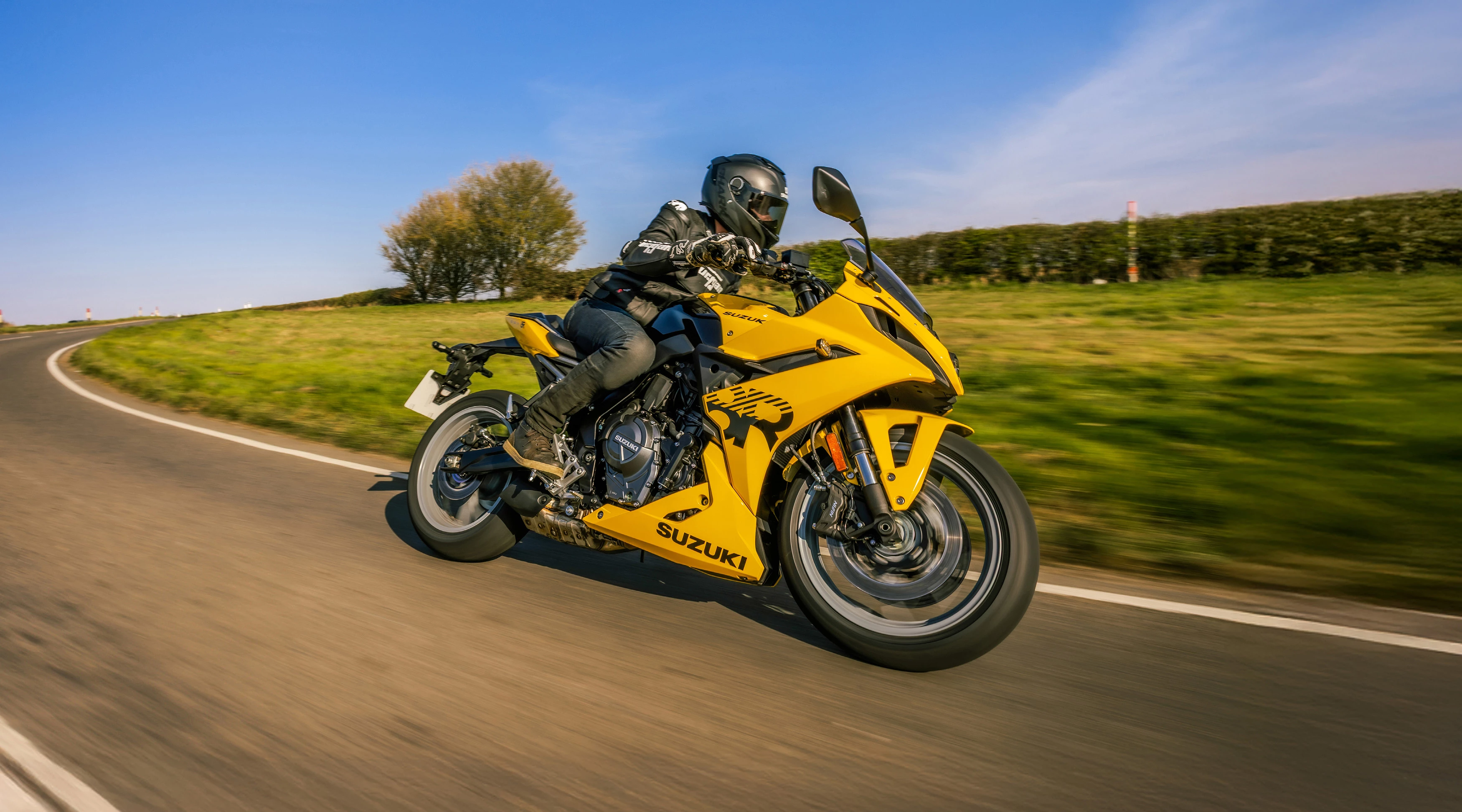 GSX-8R Kiiro Limited Edition leaning hard into a corner on a country road. 
