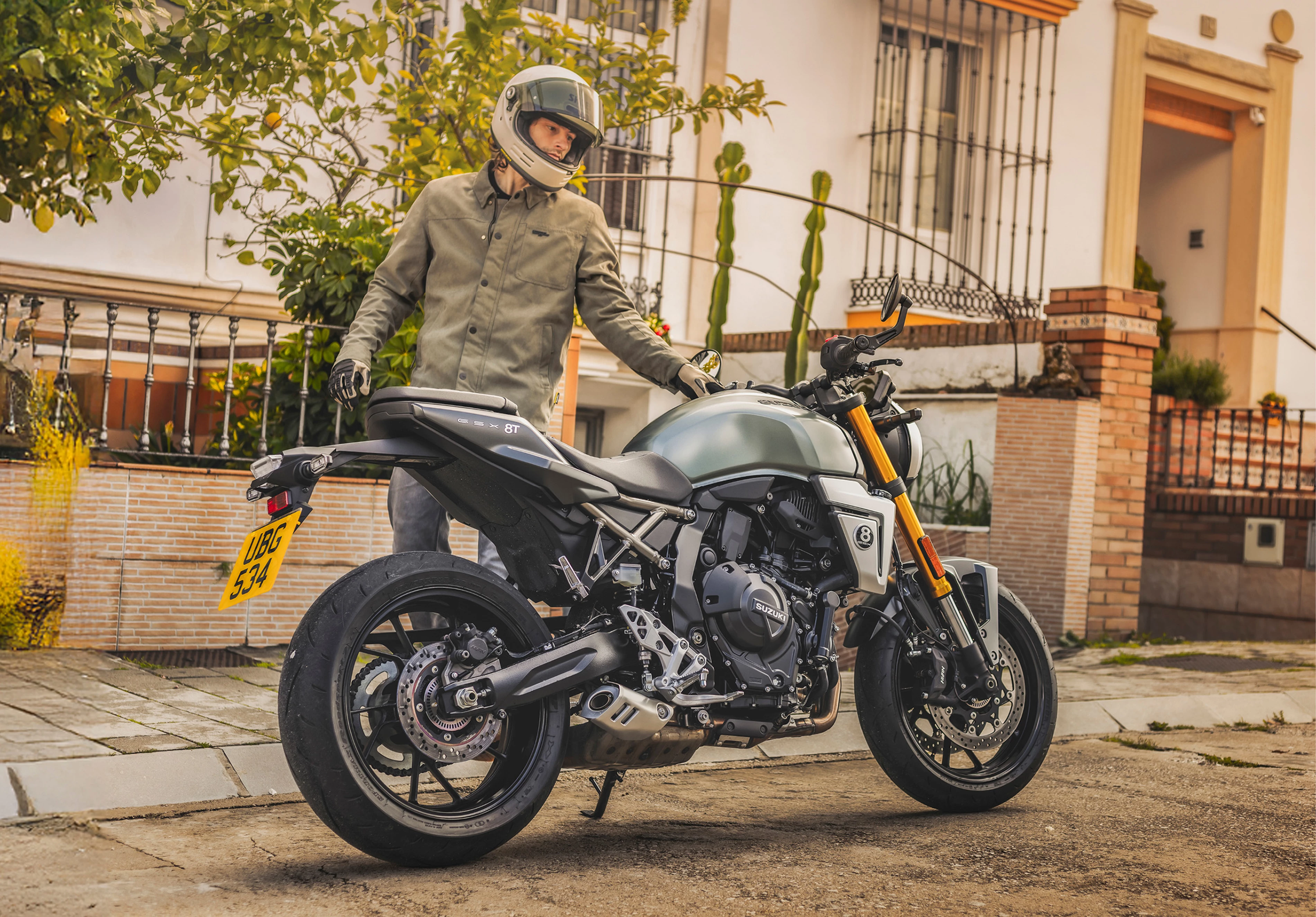 Suzuki GSX-8T right hand side static with rider behind on location