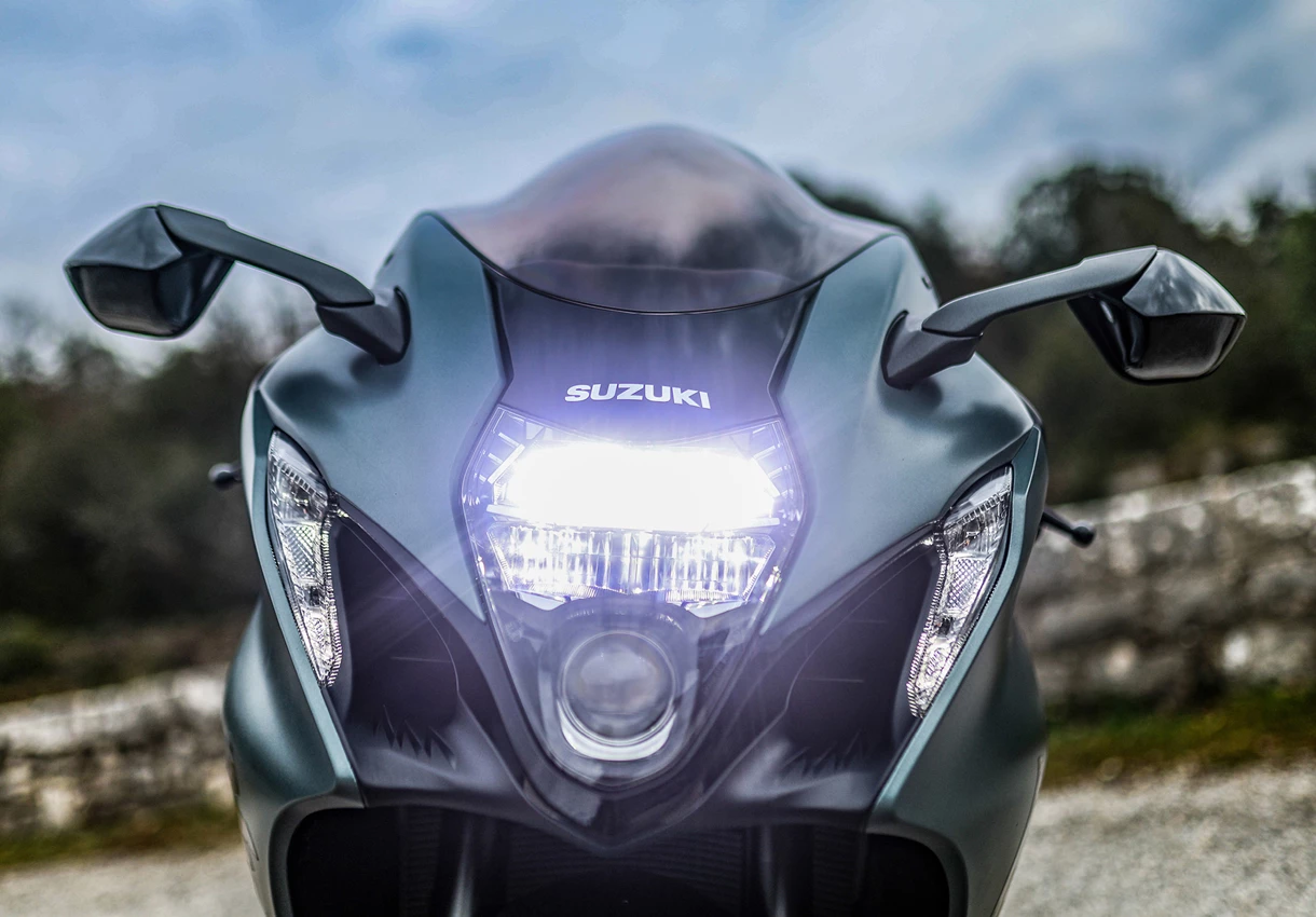Suzuki Hayabusa head on with the headlight illuminated. 
