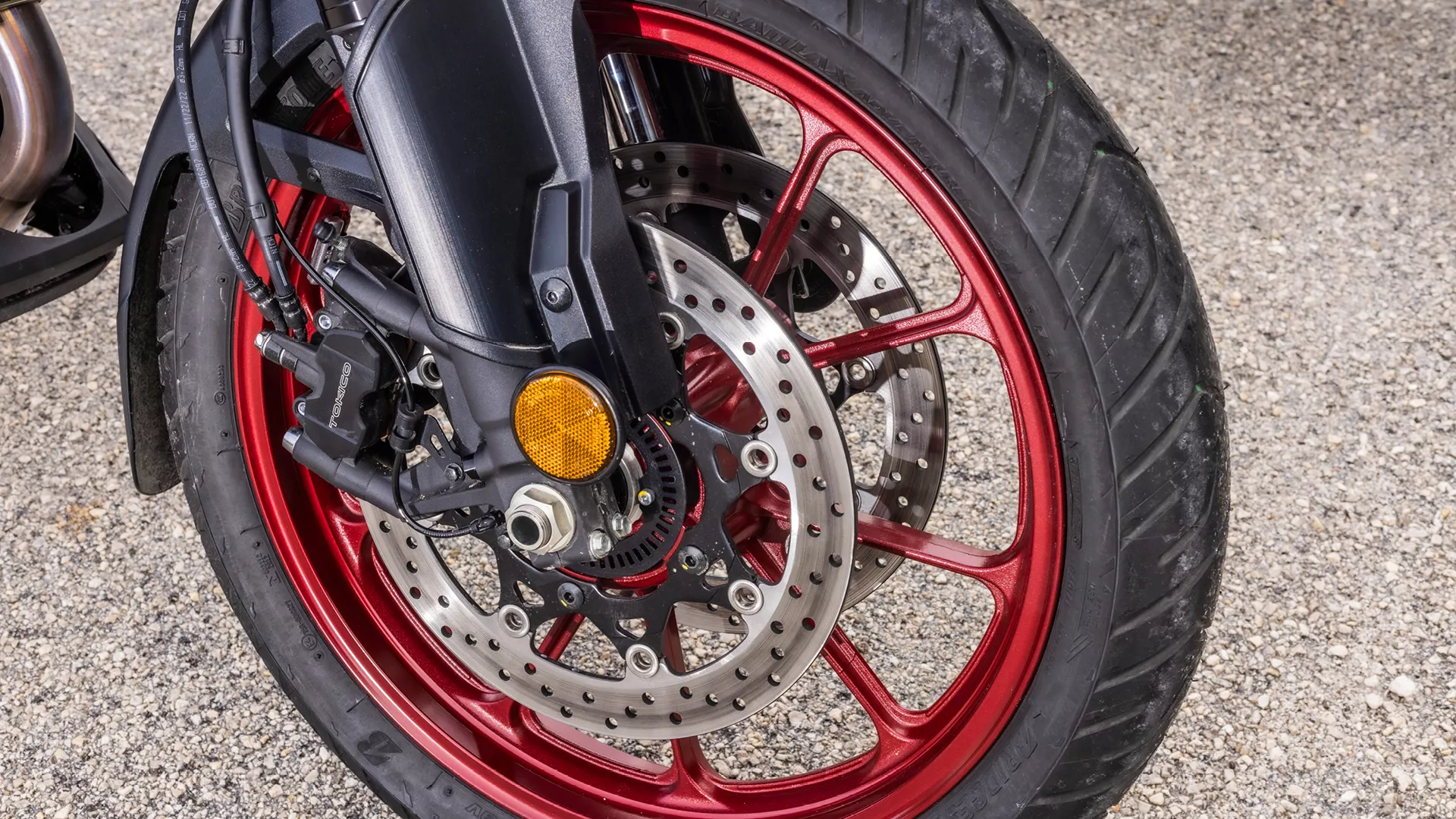 Suzuki V-Strom 1050RE front wheel and brake close-up