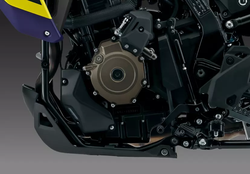 Close-up of the Suzuki V-Strom 800DE’s engine and chassis, emphasising the rugged design and engineering of this adventure motorcycle.