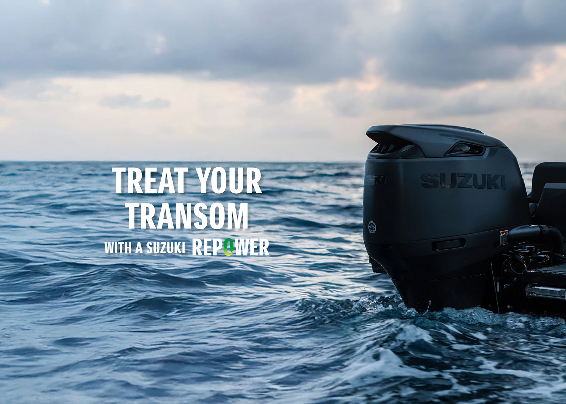 A Suzuki outboard propelling a rib though a valley.