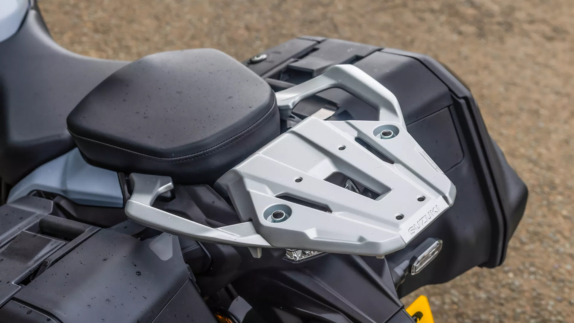 Suzuki GSX-S1000GX+ rear grab rails and carrier plate close-up