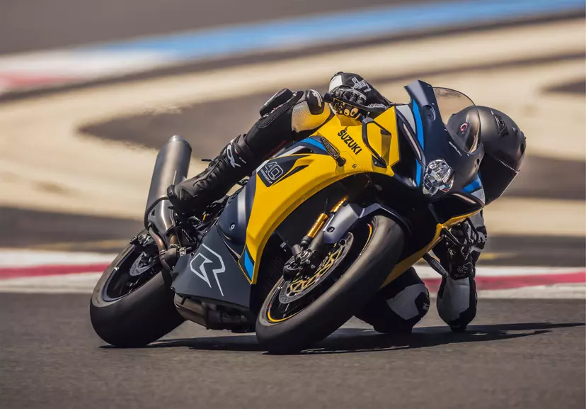 Suzuki GSX-R1000R with elbow down pushing round a corner on track