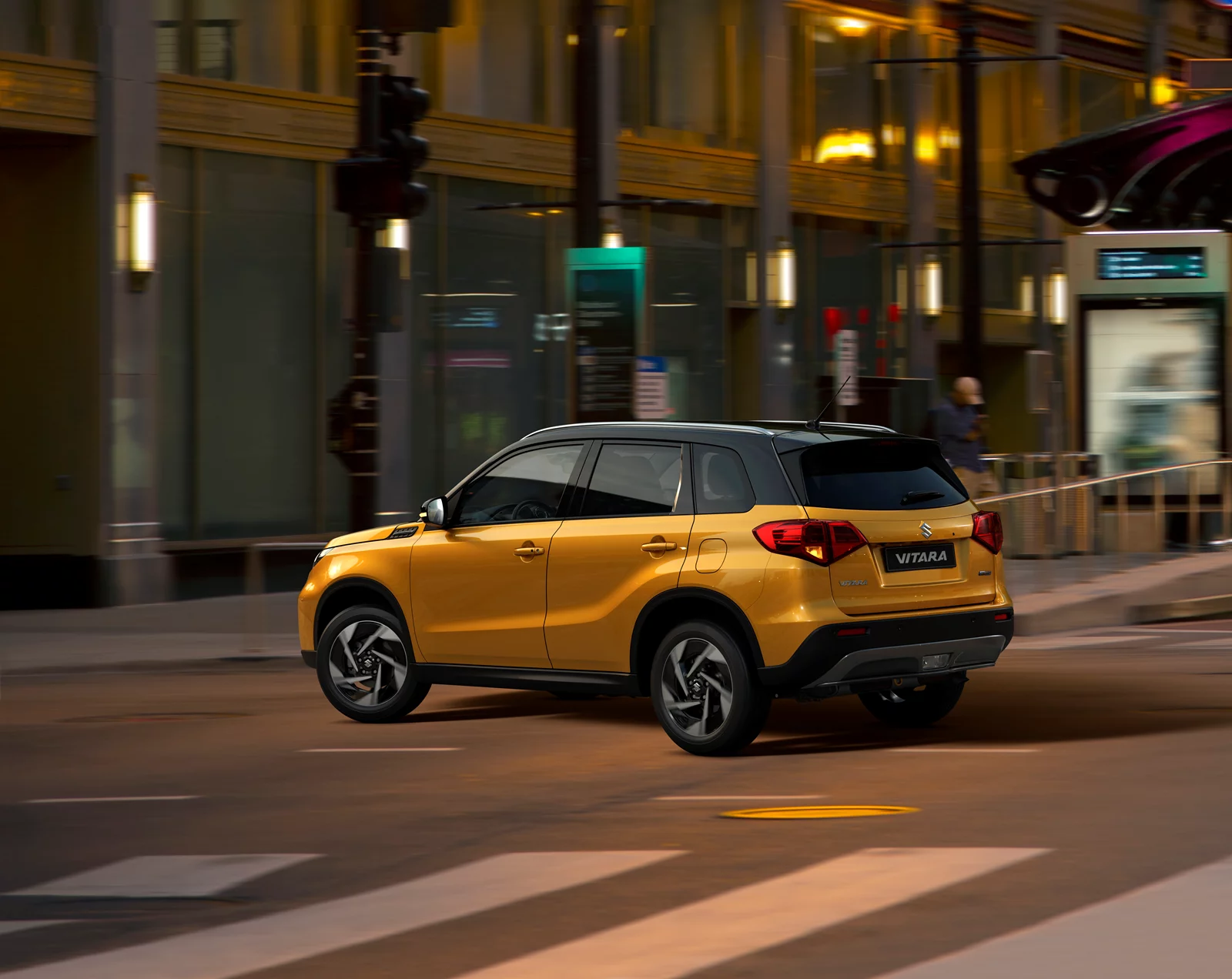 Solar Yellow Suzuki Vitara Rear side view in the City