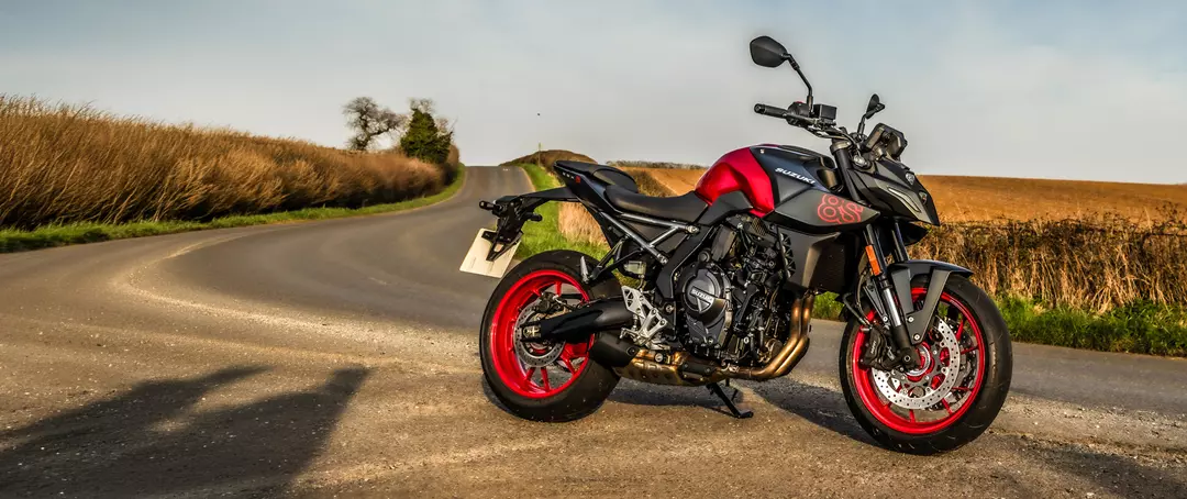 Suzuki GSX-8S red and black right hand side static with a countryside background