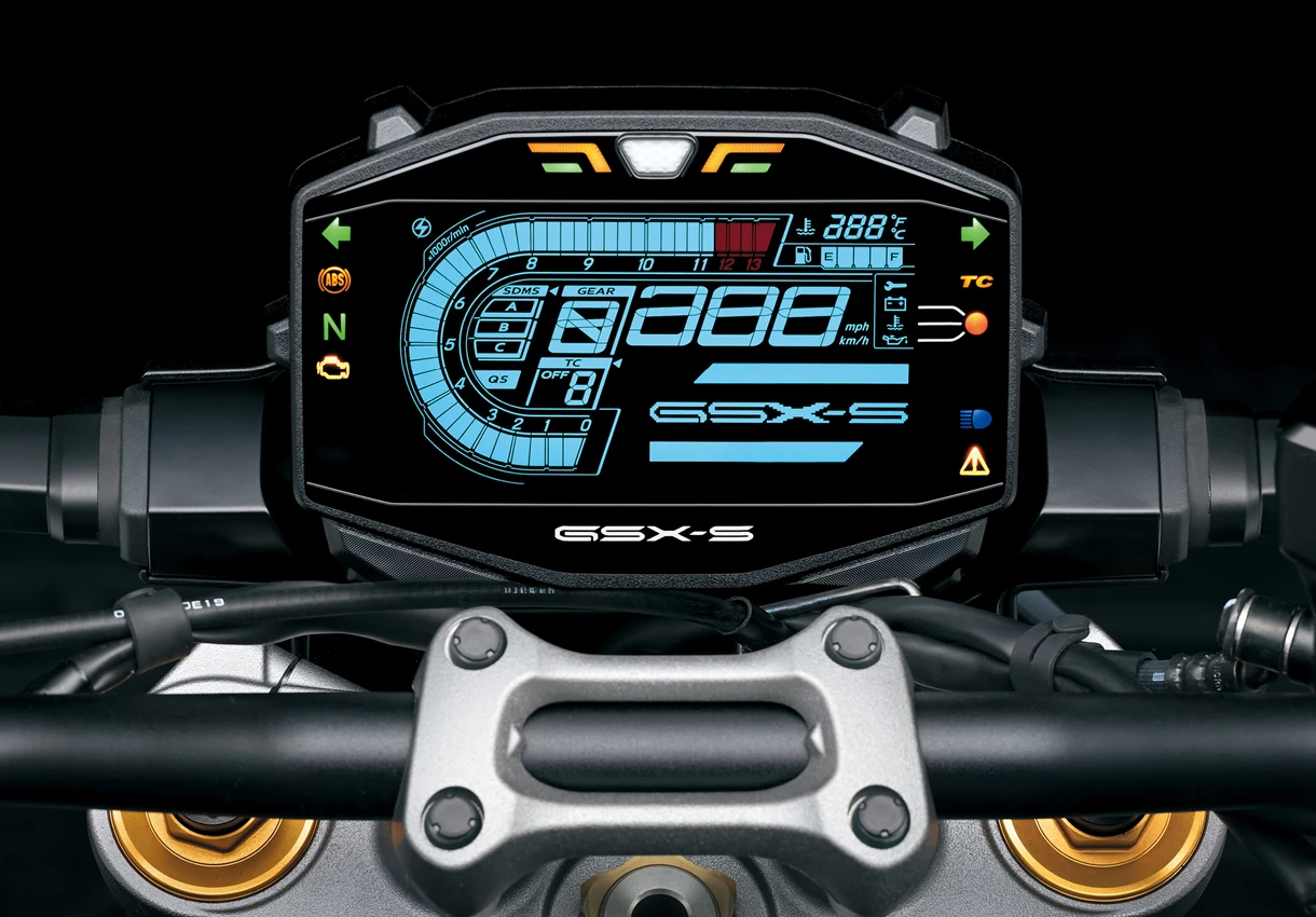 Suzuki GSX-S1000 LCD Instrument dash display close-up with a grey studio background