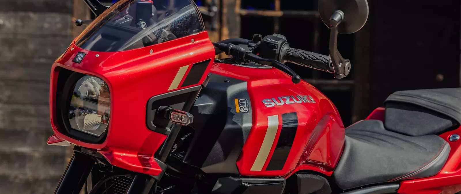 Suzuki GSX-8TT red left hand side close up of the front cowl, tank and headlight