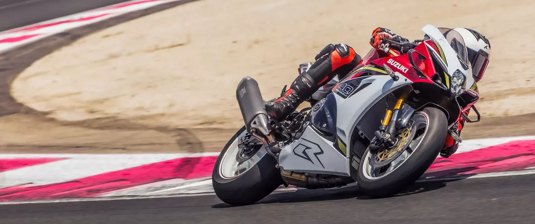 Suzuki GSX-R1000R pushing hard on the way out of a corner on track