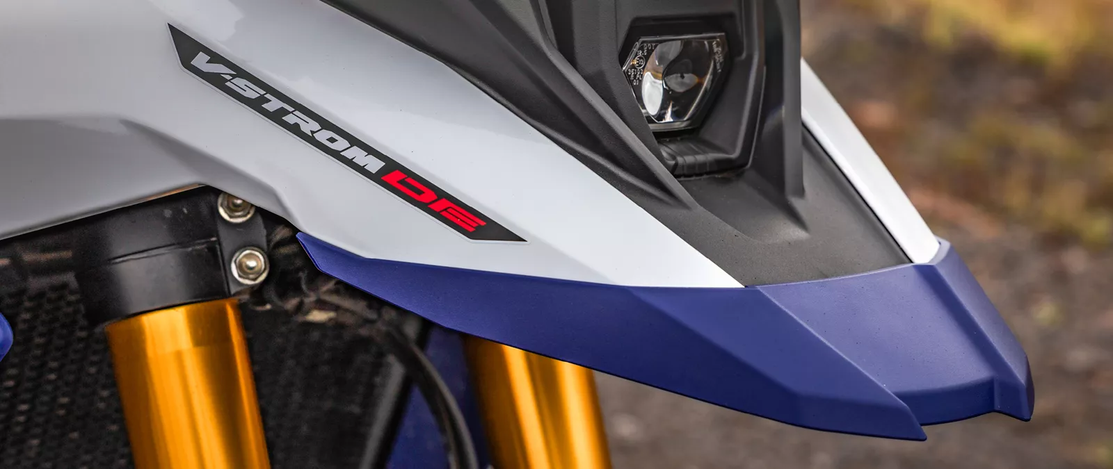 Suzuki V-Strom 800DE close up of the beak and headlight on location