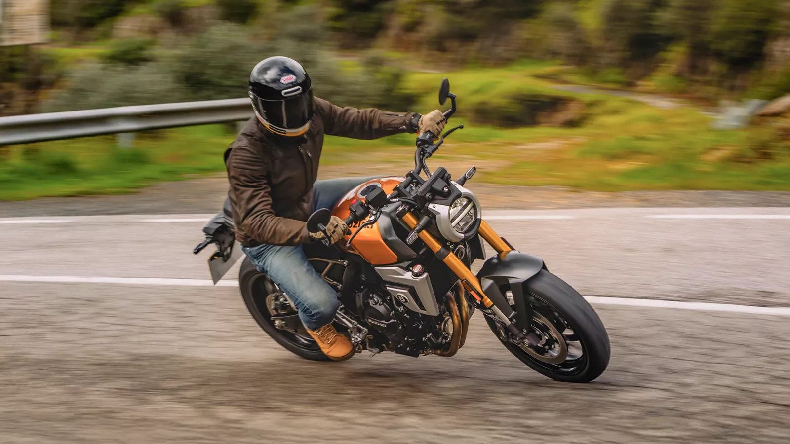 Suzuki GSX-8T leaning into a bend on a mountain road. 
