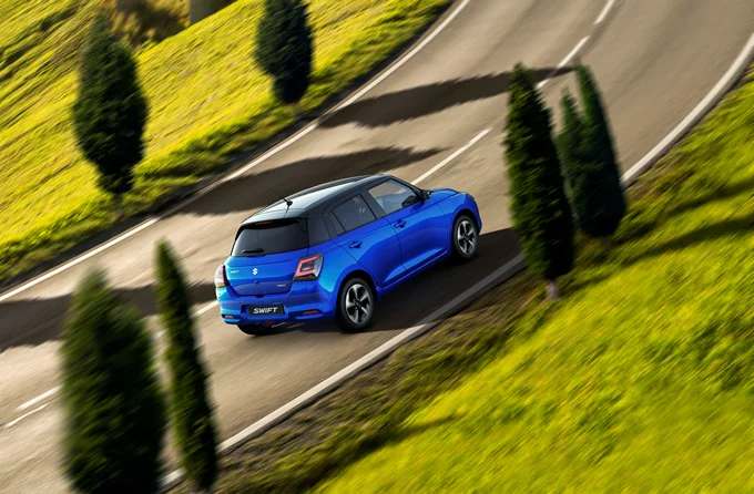Suzuki Swift Frontier Blue on country road