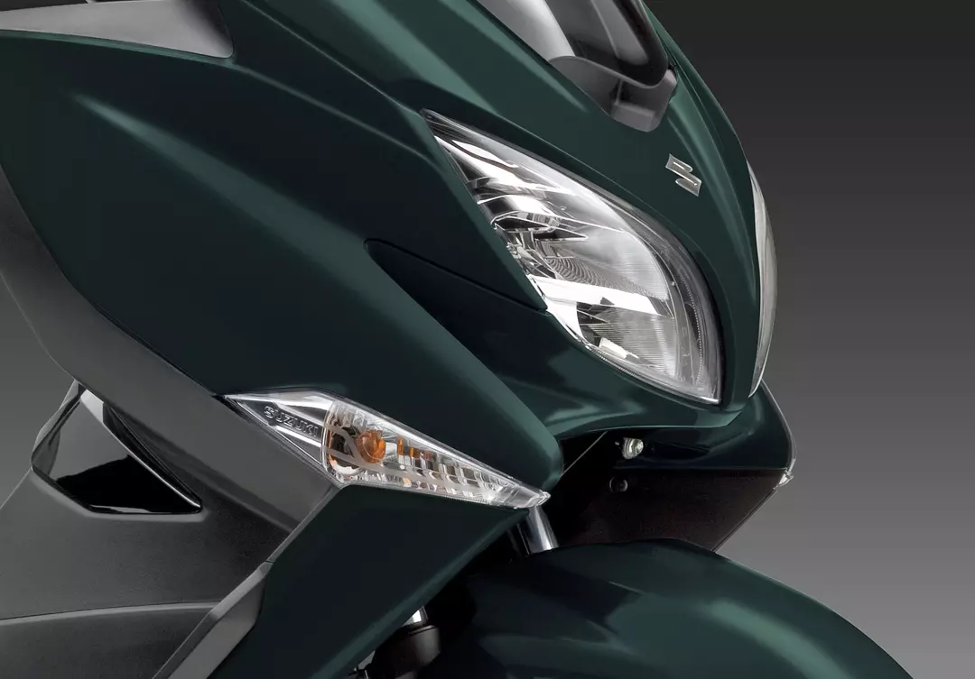 Suzuki Burgman 400 front headlight right hand side close up