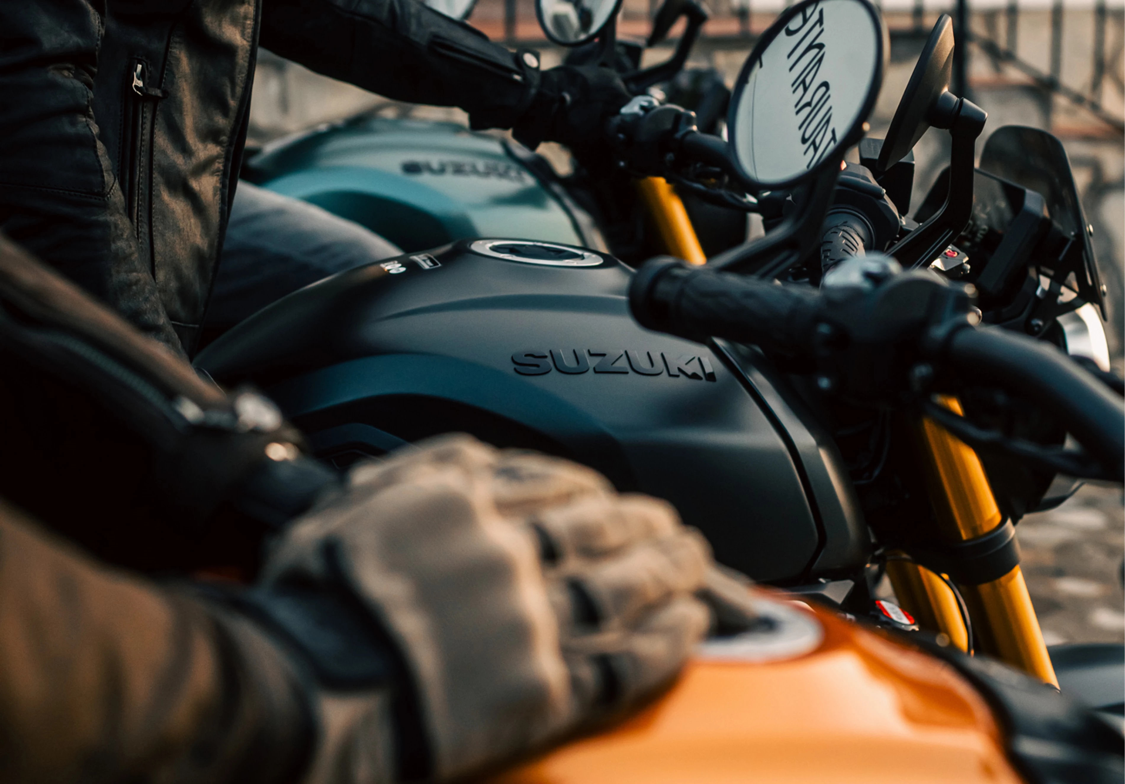 Suzuki GSX-8T three bikes in a line looking across the fuel tanks.