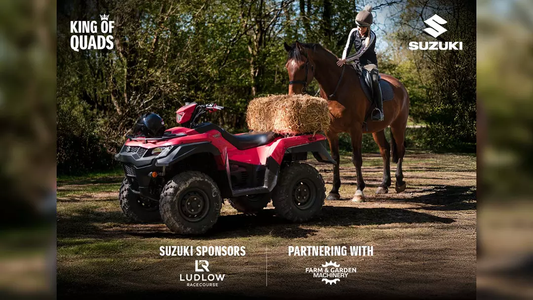 Suzuki KingQuad with horse and hay bale