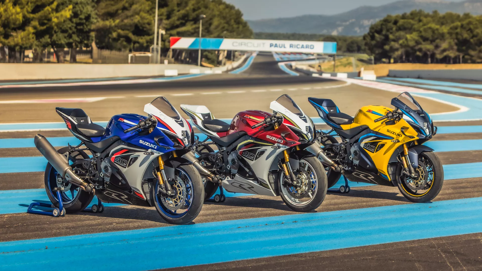 Suzuki GSX-R1000R three colour options side by side on track
