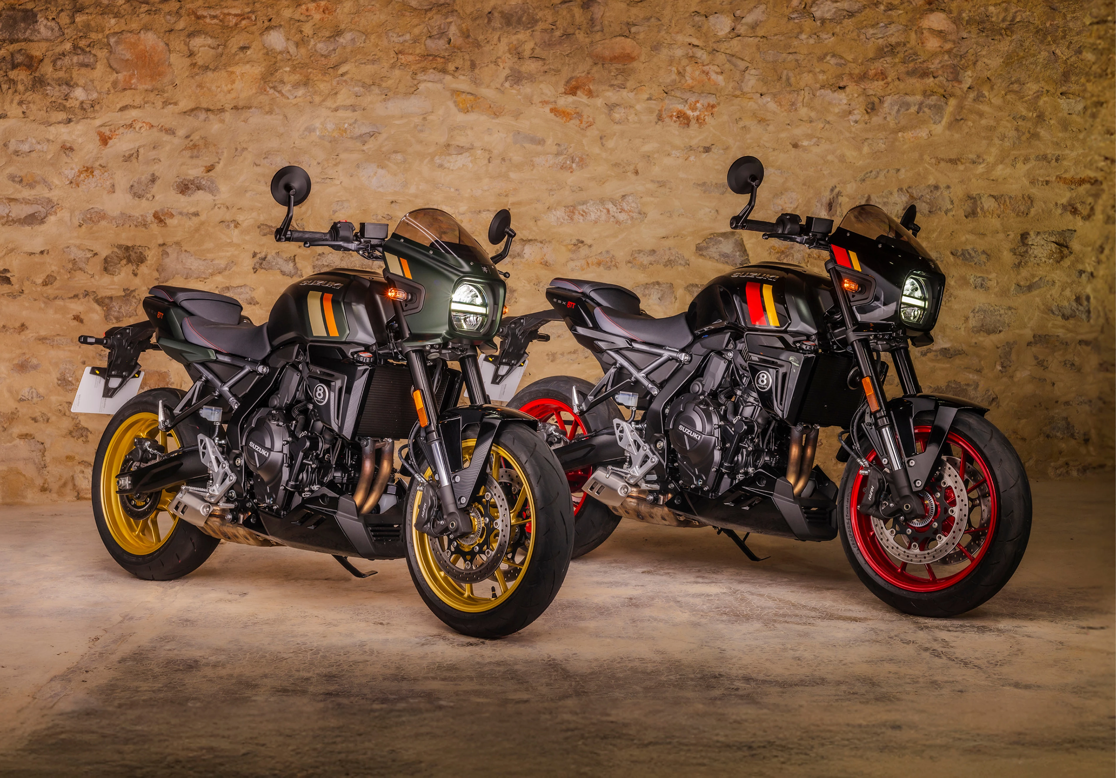 Suzuki GSX-8TT two bike static front three quarters with a barn brick wall background