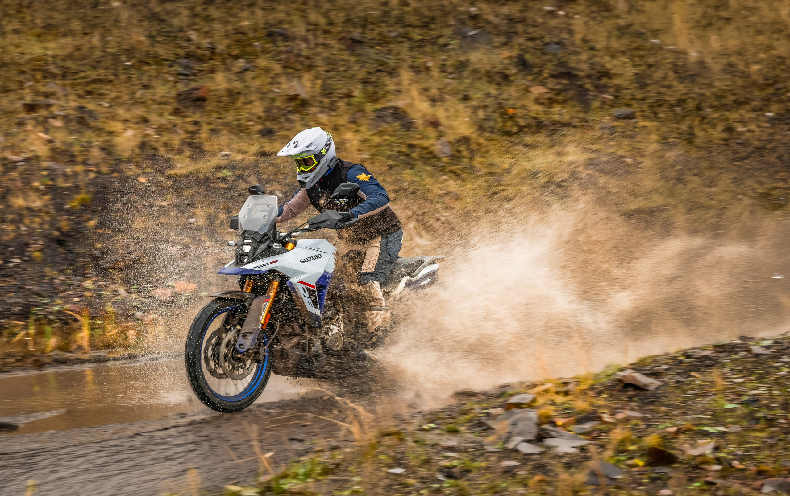 Suzuki V-Strom 800DE pushing on through a water splash