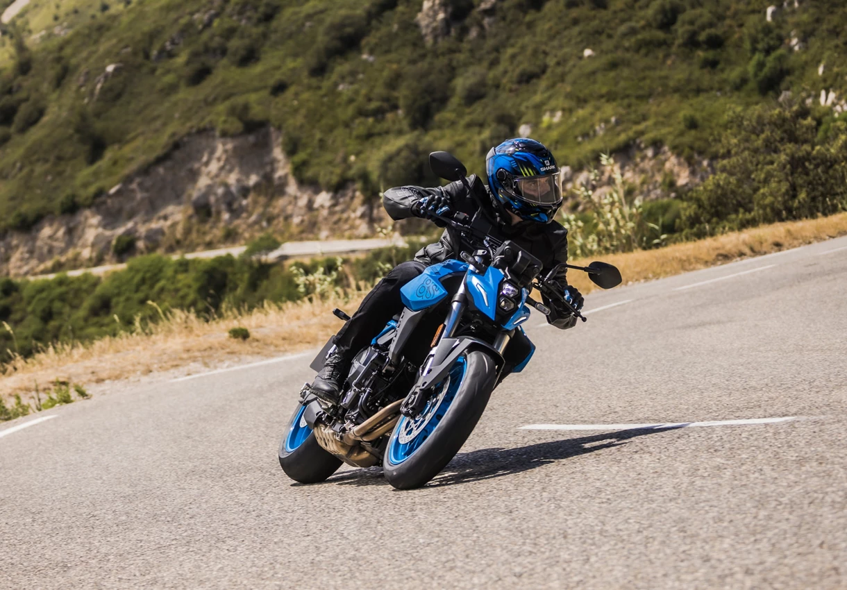 Suzuki GSX-8S leaning into a corner on a mountain road