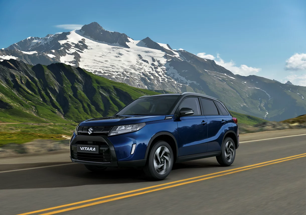 Suzuki Vitara blue driving in mountains