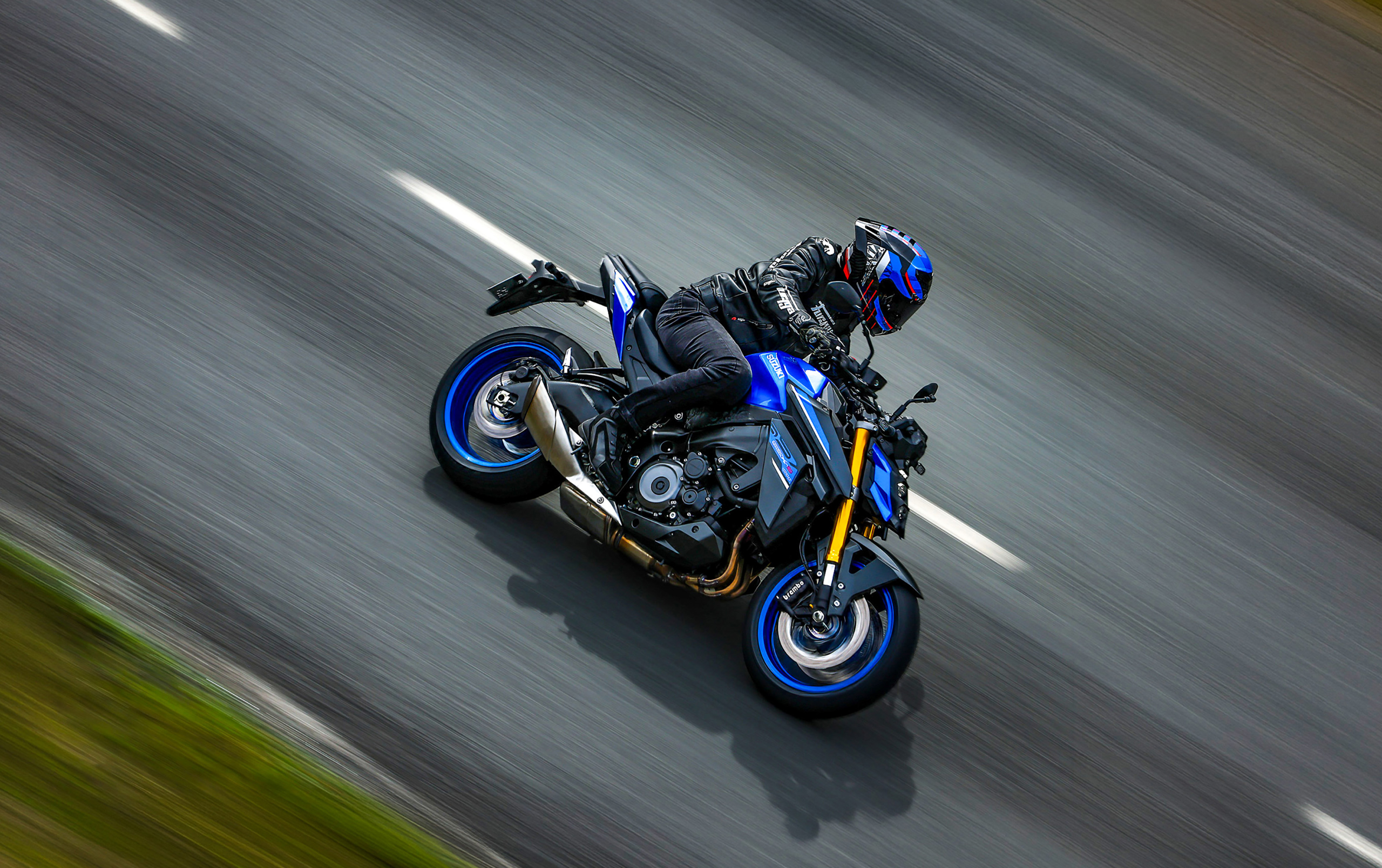 Suzuki GSX-S1000 blue high shot of the bike side on in a curve