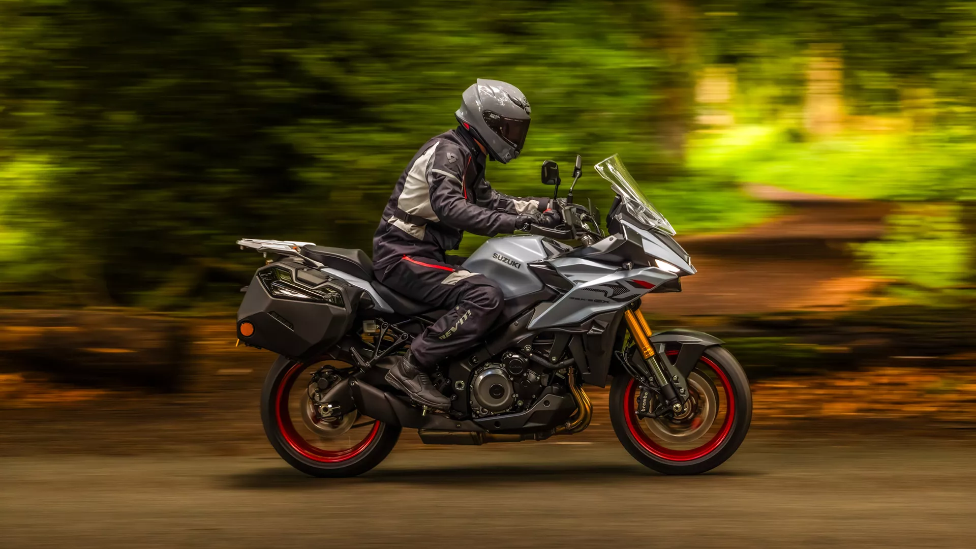 Suzuki GSX-S1000GX+ on a tree lined load